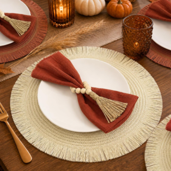Bohemian-style round woven placemat set (6-pack) with tassel accents, ideal for festive gatherings